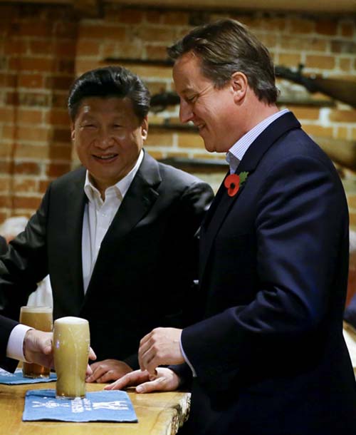 Cameron convida presidente chinês para cerveja com peixe e batatas fritas num pub