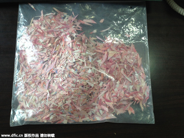 Filho rep?e 140,000 yuans em notas cortadas em peda?os destruídas por impulso do pai