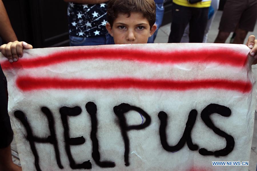 Refugiados protestam por melhores condi??es de vida na Grécia