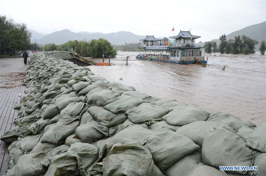 Forte chuva tira milhares de casa após tuf?o no nordeste da China