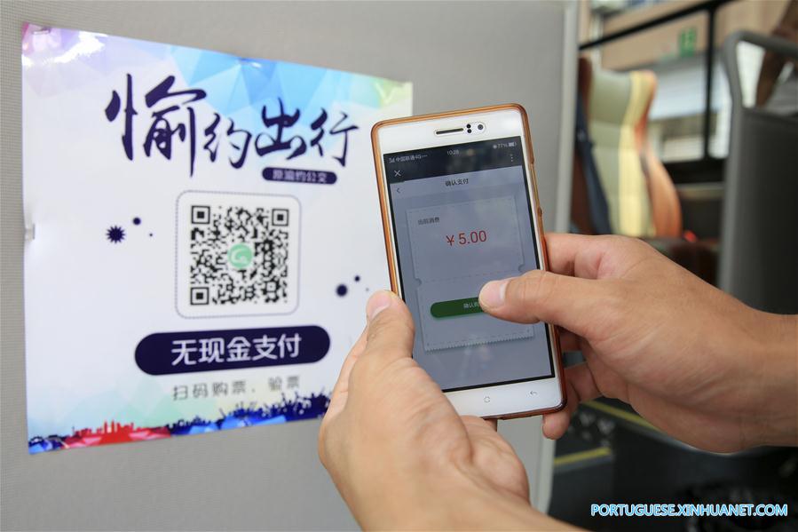 Pagamentos móveis entram em opera??o em linhas de ?nibus em Chongqing, no sudoeste da China