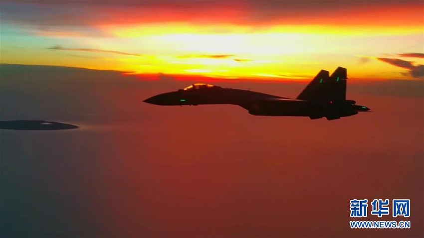 For?a Aérea da China participa em patrulha conjunta sobre Mar do Sul da China