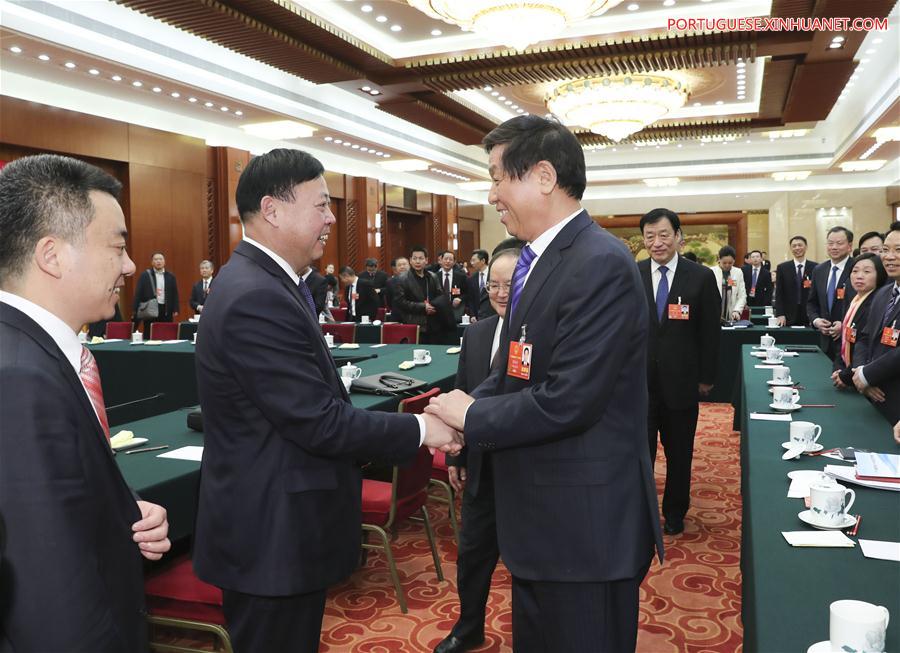 Líderes de alto escal?o se reúnem com legisladores nacionais e destacam status de núcleo de Xi