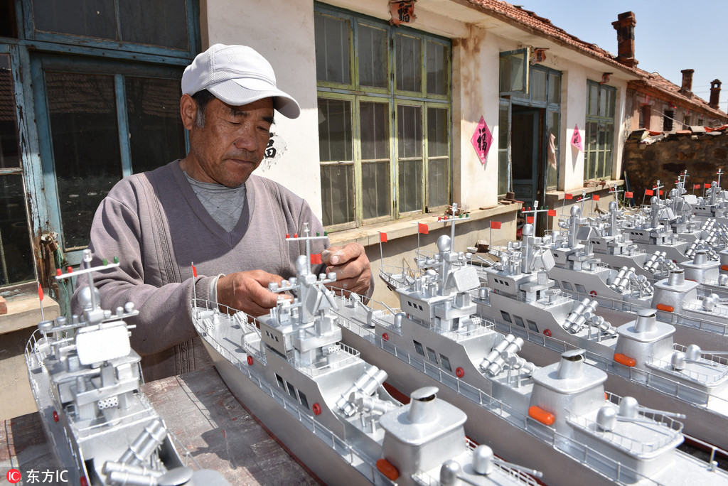 Pescador de Shandong dedica-se à cria??o de maquetes de navios de guerra
