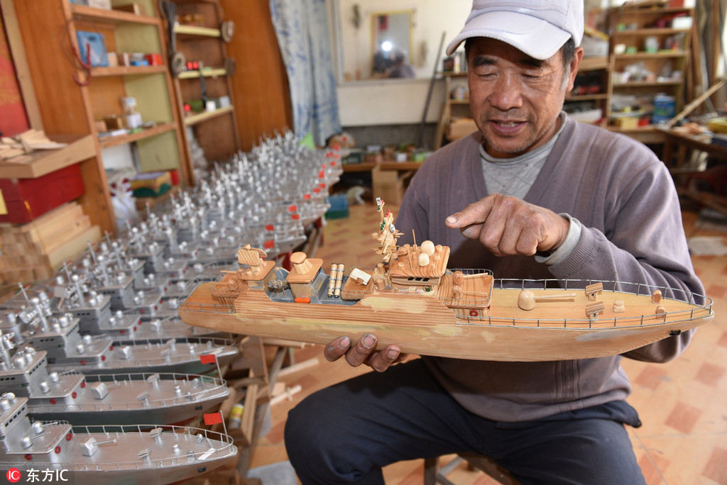Pescador de Shandong dedica-se à cria??o de maquetes de navios de guerra