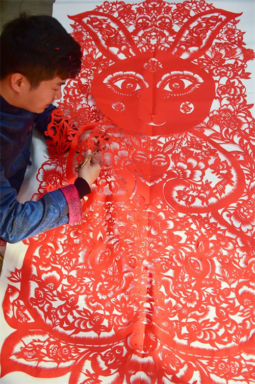 Cem coelhos em corte de papel s?o preparados para receber Ano Novo Chinês do Coelho