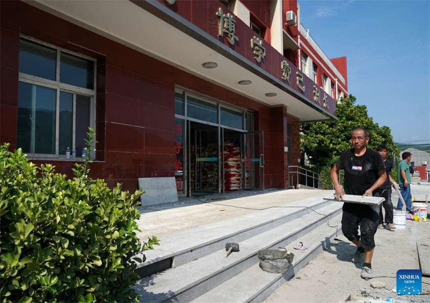 Beijing: escolas iniciam processo de reconstru??o após cheias