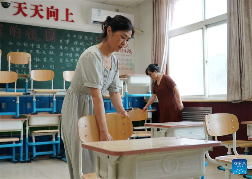 Beijing: escolas iniciam processo de reconstru??o após cheias