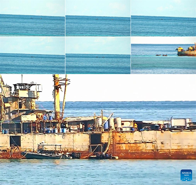 Tripula??o da marinha filipina em navio encalhado ilegalmente destrói redes de pesca chinesas