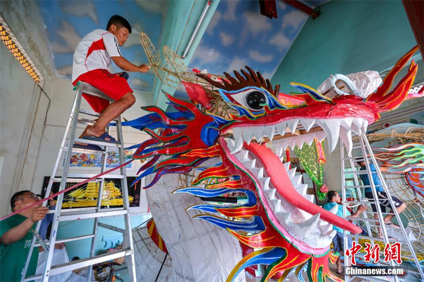 Hainan prepara cabe?as de drag?o para dar boas-vindas ao Festival do Barco-Drag?o
