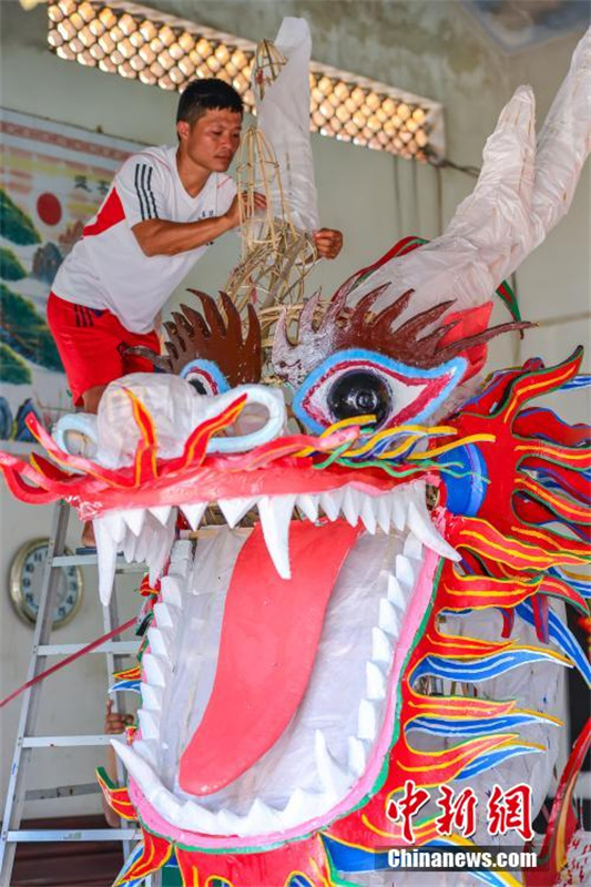 Hainan prepara cabe?as de drag?o para dar boas-vindas ao Festival do Barco-Drag?o