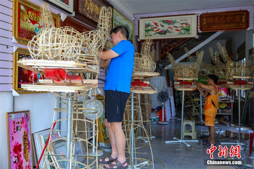 Hainan prepara cabe?as de drag?o para dar boas-vindas ao Festival do Barco-Drag?o