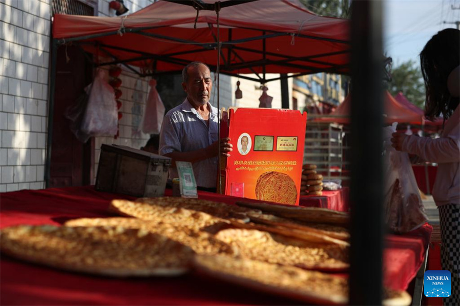 Técnicas tradicionais de fabrica??o de naan herdadas e desenvolvidas em Xinjiang